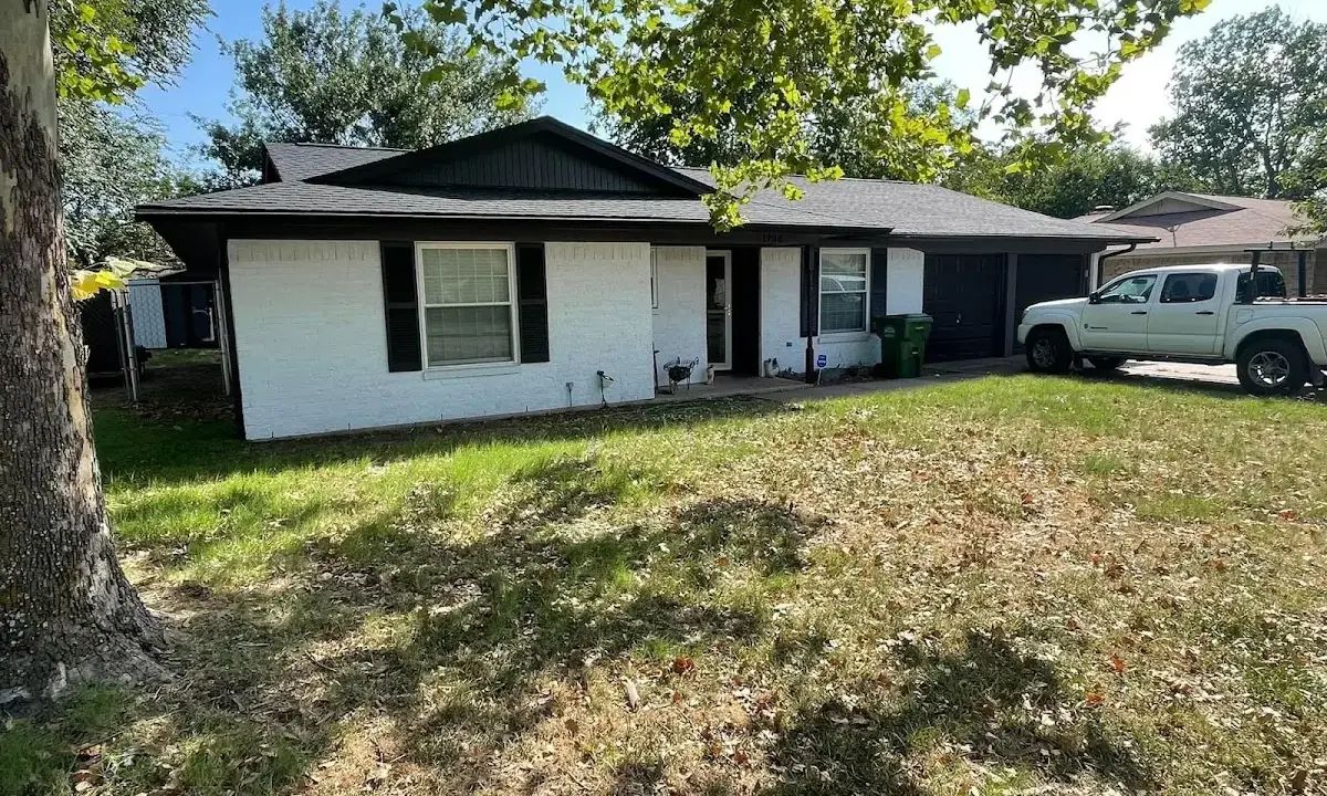 Professional roofing crew working on a residential roof in Oakville